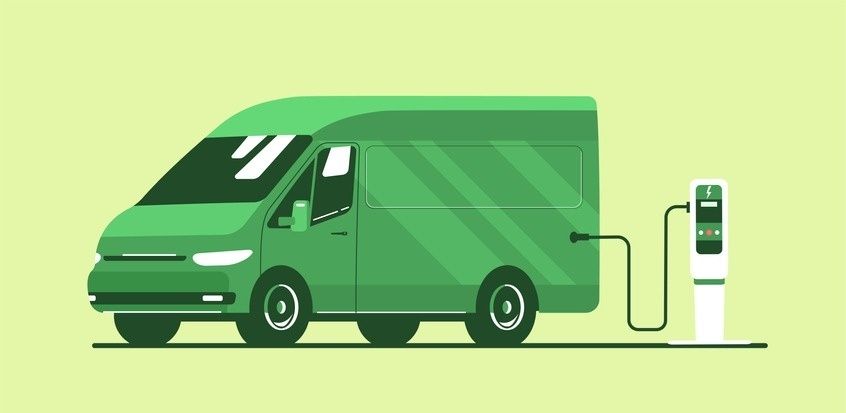 Grüner Elektro-Transporter an einer Ladestation für nachhaltige Logistik